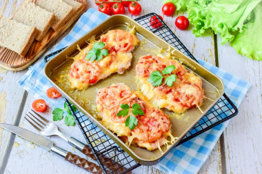 Chicken with cheese and tomatoes baked in the oven