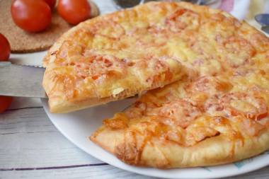 Pizza with smoked sausage and cheese