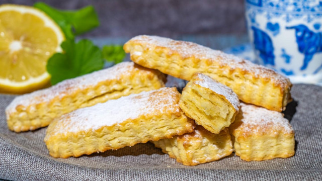 Pastry Tongues of puff pastry with sugar