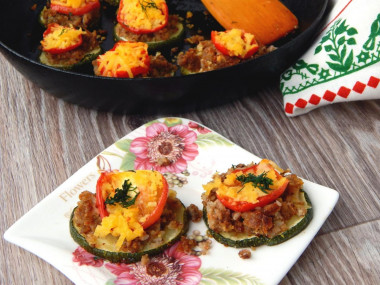 Young zucchini towers baked with tomatoes and cheese