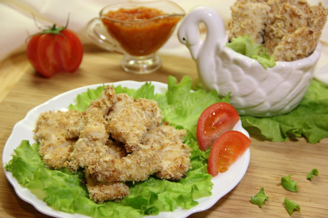 Chicken fillet in bread crumbs baked in sour cream