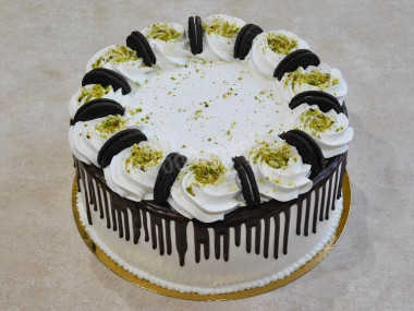 Cake with nuts, prunes, sour cream and cream