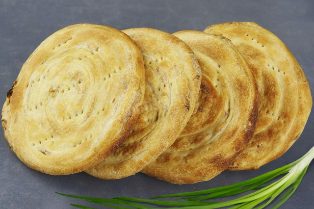 Uzbek puff pastry in melted butter