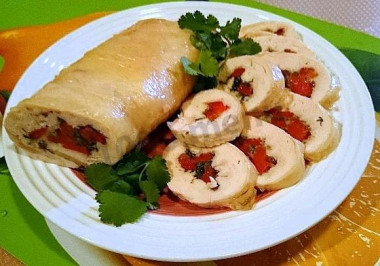 Chicken roll with bell pepper on gelatin in film