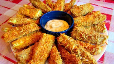 Young zucchini in crispy cheese breading