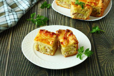 Layered pie with chicken and potatoes