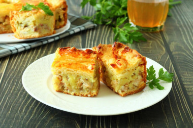 Layered pie with chicken and potatoes