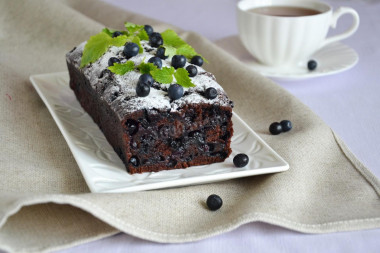 Chocolate cupcake with cognac and blueberries