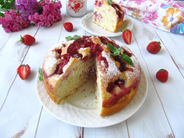 Cupcake with coconut and strawberries in milk