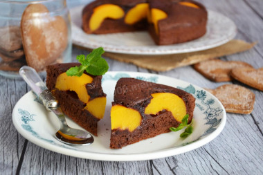 Fruit and chocolate cake with peaches