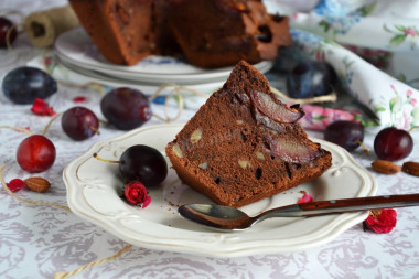 Chocolate cupcake with plums and walnuts