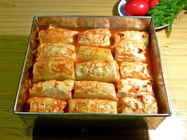 Stuffed cabbage rolls with minced meat in the oven in tomato sauce