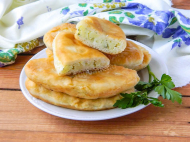 Fried pies in a pan with dry yeast