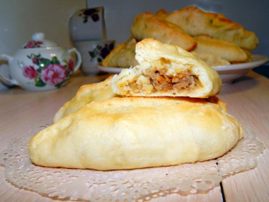 Yeast pastry pies with meat and potatoes