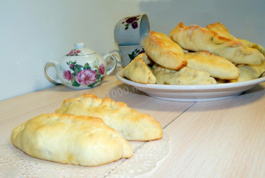 Yeast pastry pies with meat and potatoes