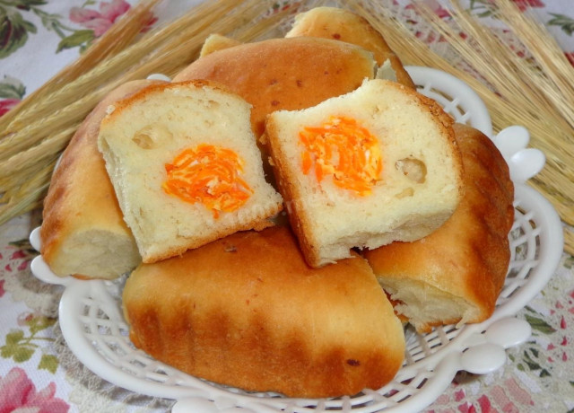 Carrot pies made from yeast dough on kefir