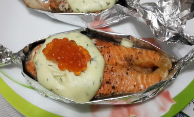 Salmon in a boat with cream sauce