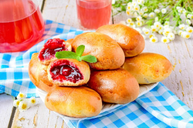 Pies with jam in the oven made of yeast dough