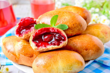 Pies with jam in the oven made of yeast dough