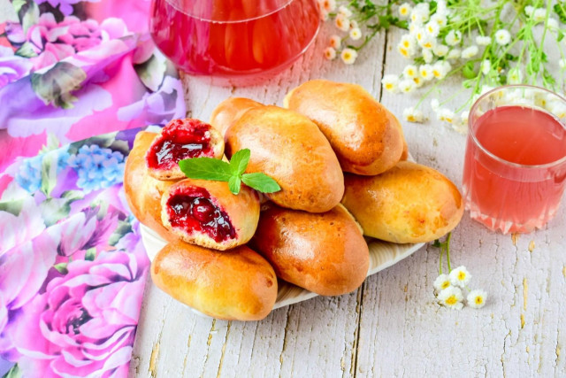 Pies with jam in the oven made of yeast dough