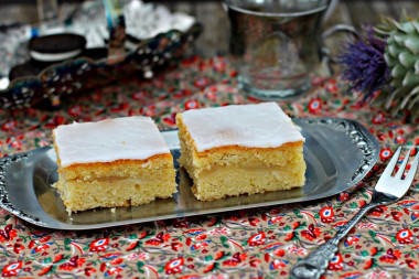 Shortbread pie with icing and apple filling