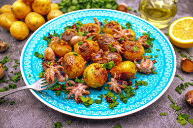 Small octopuses frozen in a frying pan with potatoes