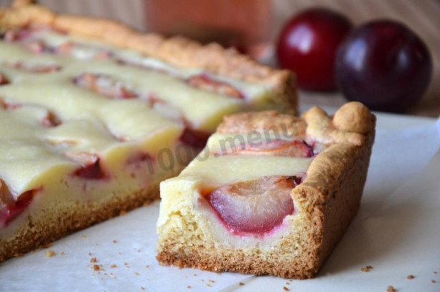 Sour cream pie with plums on sour cream