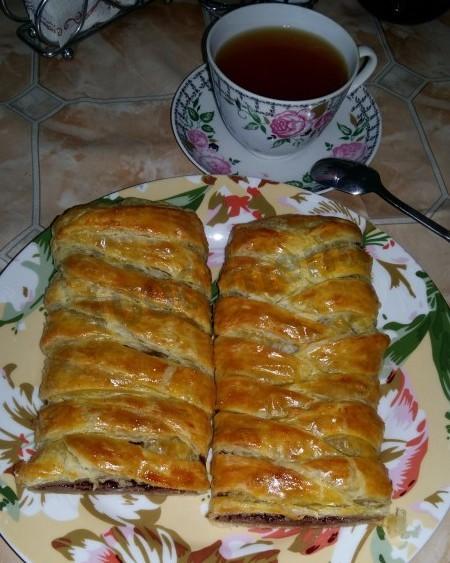 Puff pastry roll with chocolate and nuts