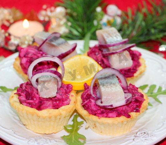 Herring under a fur coat in potato tartlets salad