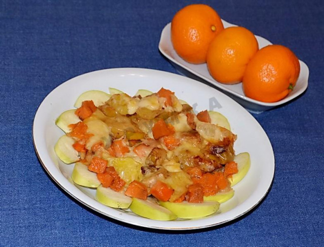 Baked pumpkin with apples, oranges, cheese and cinnamon