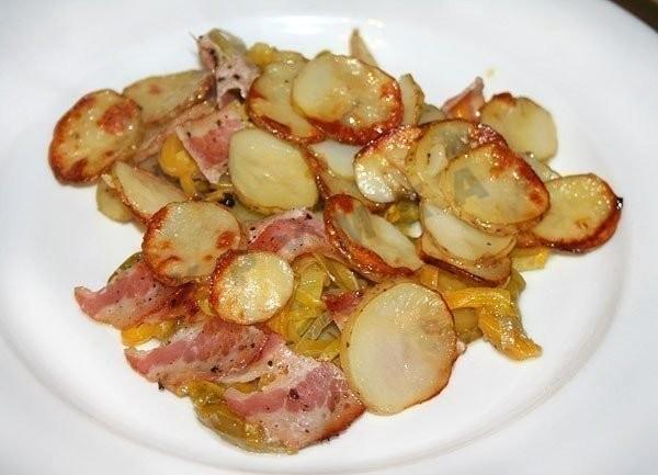 New potatoes baked with vegetables and bacon