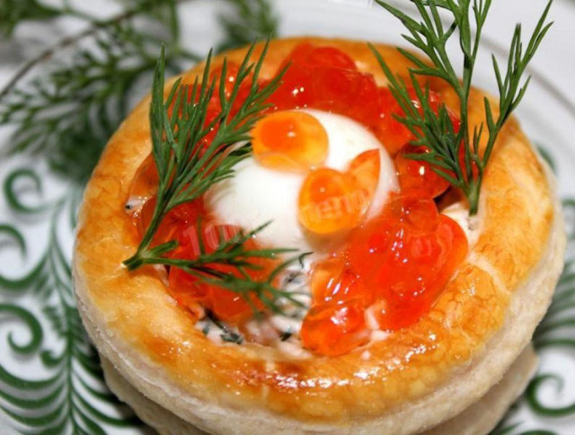 Puff pastry rolls with caviar and quail eggs