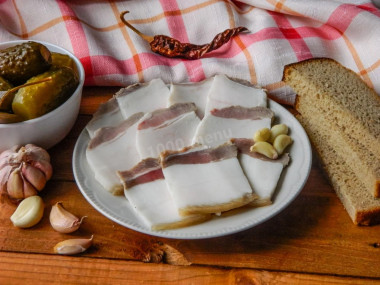 Lard in a jar with garlic in brine