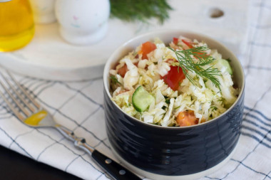 Salad of Peking cabbage cucumbers and tomatoes