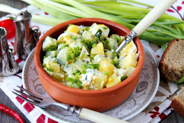 Salad with potatoes, egg and cucumber