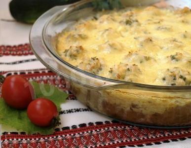 Zucchini casserole with grape leaves and chicken meat