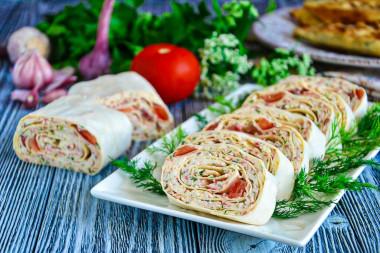 Pita bread roll of crab sticks and processed cheese