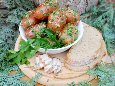 New potatoes with garlic in a uniform with fragrant dressing