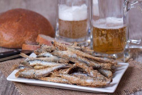 Baked capelin in the oven in breadcrumbs