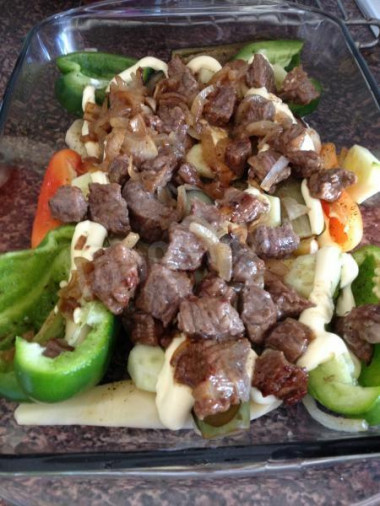 Meat in cauliflower with vegetables in the oven