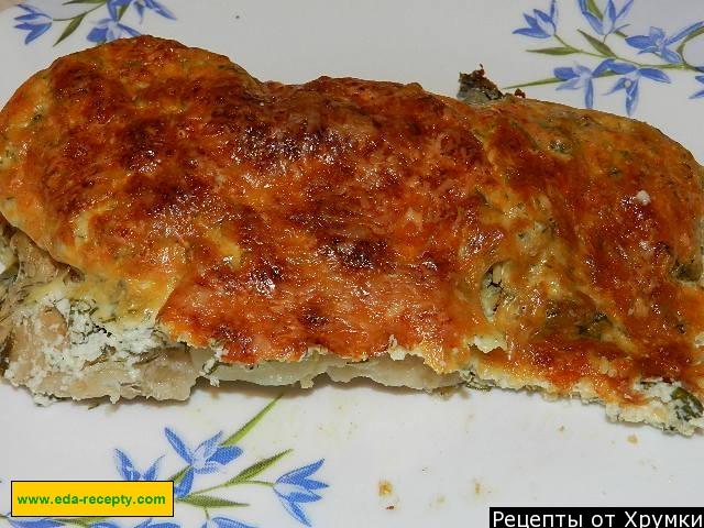 Crucian carp with cheese in the oven