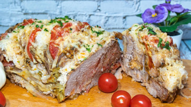 Pork with stuffing baked in cabbage leaves in foil