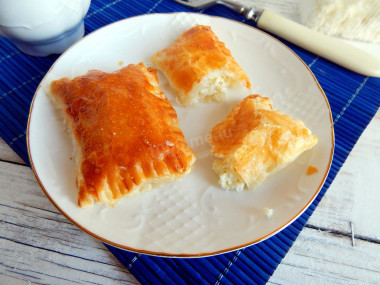 Salted puff pastry envelopes dough with cottage cheese