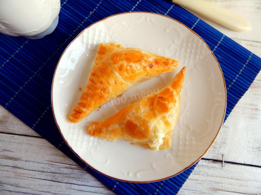 Salted puff pastry envelopes dough with cottage cheese