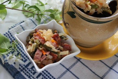 Stew with cabbage beans and smoked chicken in pots