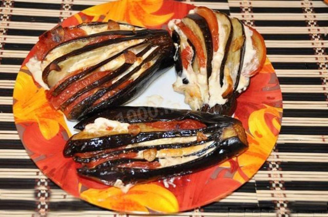 Snack Eggplant fan with tomatoes and soft feta cheese