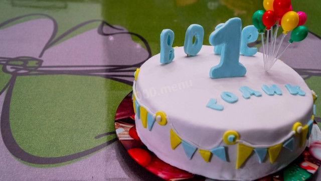 Birthday cake with a delicate sponge cake and a sand layer