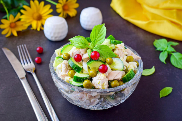 Salad with chicken, green peas, cucumber and egg