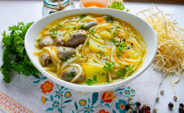 Soup with chicken hearts noodles and potatoes