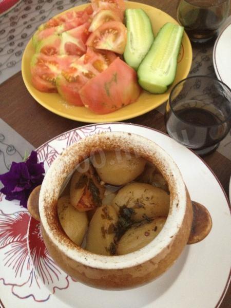 Beef with vegetables and adjika in pots